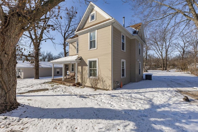 front of property featuring covered porch and central air condition unit