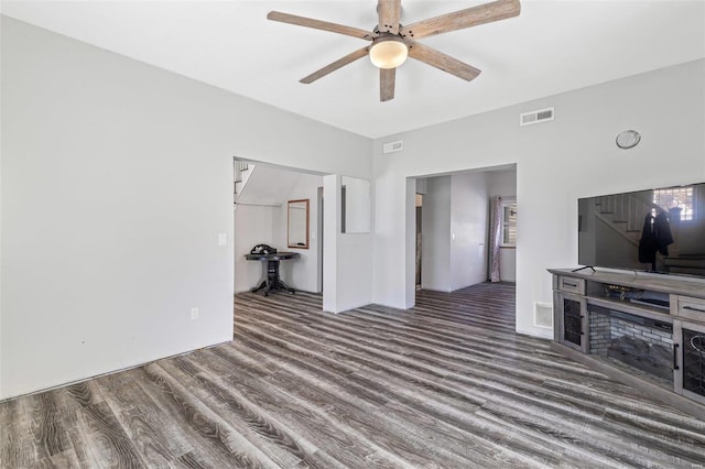 living room with ceiling fan and hardwood / wood-style flooring