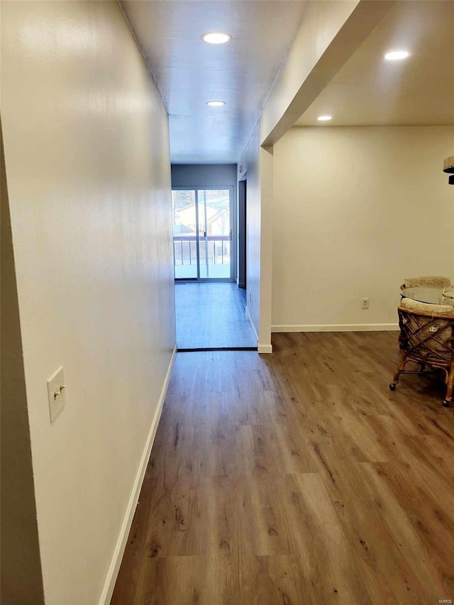 hall with wood-type flooring