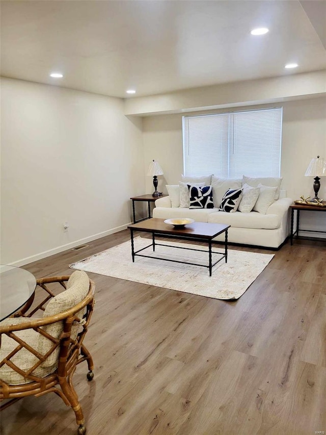 living room with light hardwood / wood-style floors