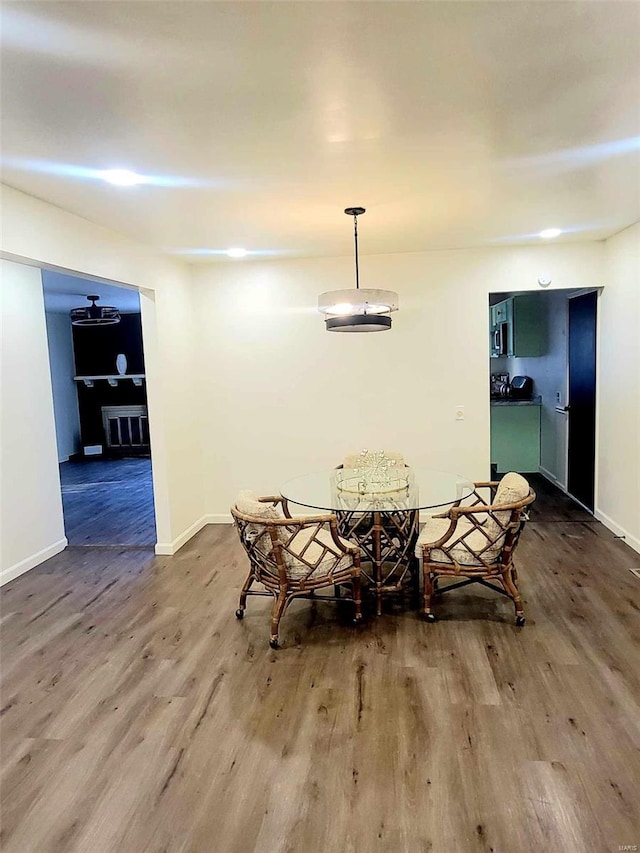 dining area featuring wood-type flooring