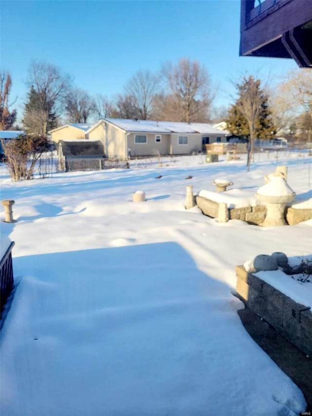 view of yard covered in snow