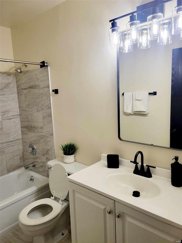 full bathroom with vanity, toilet, and tiled shower / bath combo