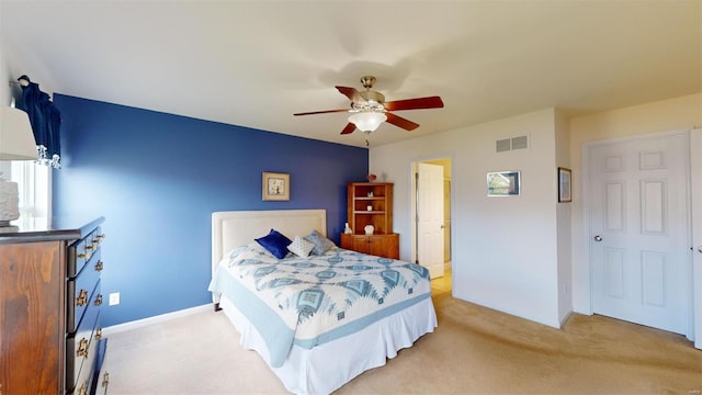 bedroom with ceiling fan and light colored carpet