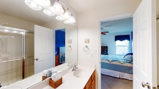 bathroom with ceiling fan, walk in shower, and vanity