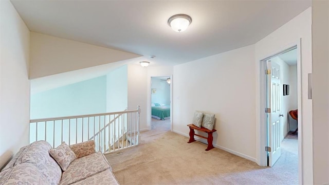 sitting room featuring light carpet