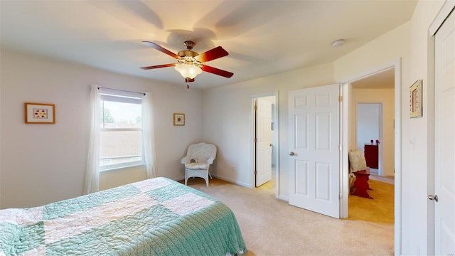 bedroom with light carpet and ceiling fan