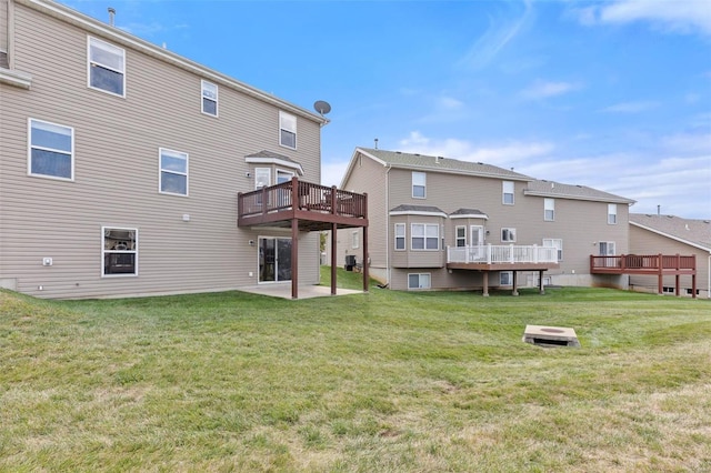 rear view of property featuring a patio area and a yard