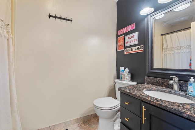 bathroom with toilet and vanity