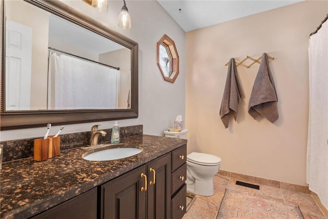 bathroom with toilet and vanity