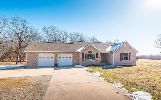 view of front of home featuring a garage and a front yard