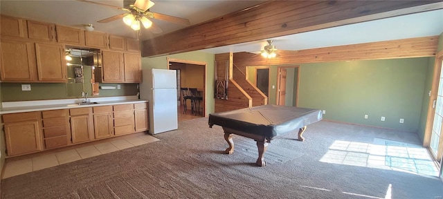 kitchen featuring light carpet, billiards, ceiling fan, freestanding refrigerator, and a sink