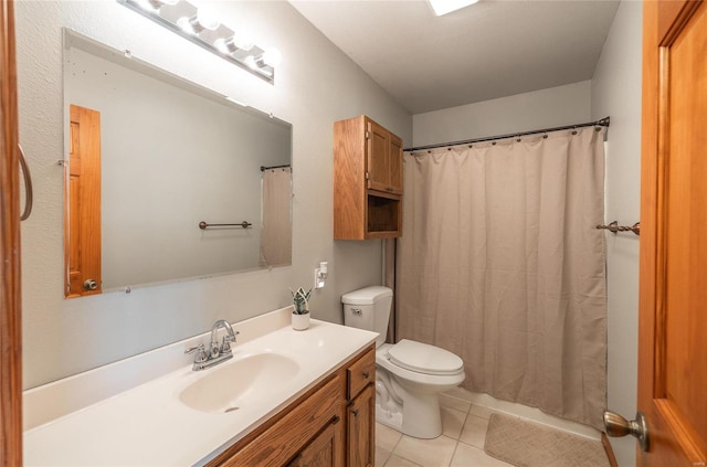 bathroom featuring tile patterned flooring, a shower with curtain, vanity, and toilet