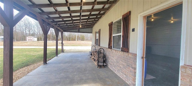 view of patio / terrace with an outbuilding