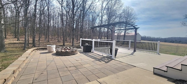 view of patio / terrace featuring an outdoor fire pit