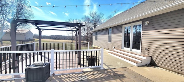 deck with entry steps, a pergola, and a patio