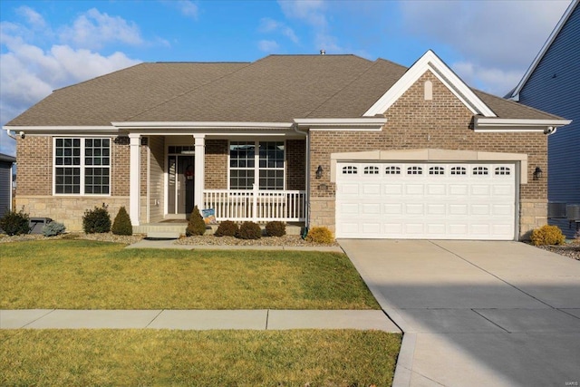 view of front of home featuring concrete driveway, a front yard, covered porch, a garage, and stone siding