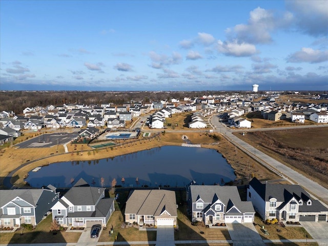 aerial view with a residential view and a water view