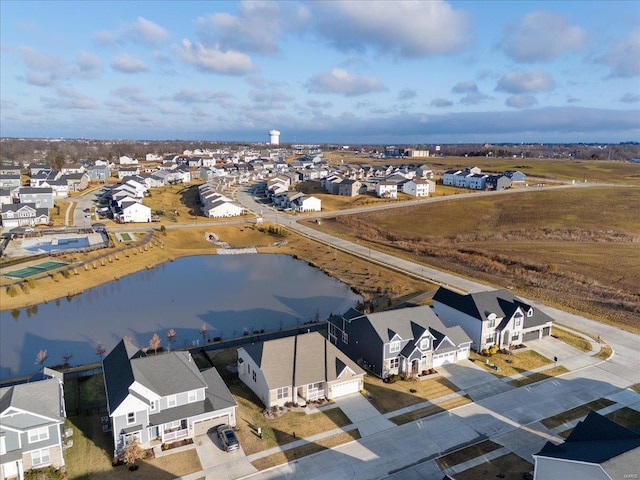 bird's eye view featuring a residential view and a water view