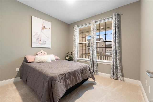 carpeted bedroom with baseboards