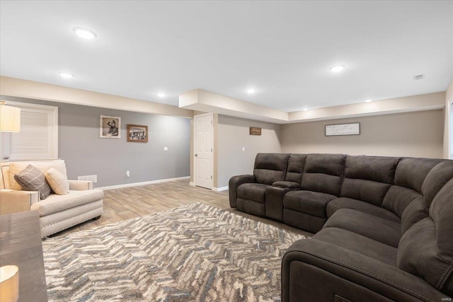 living area with recessed lighting, visible vents, baseboards, and light wood-style flooring