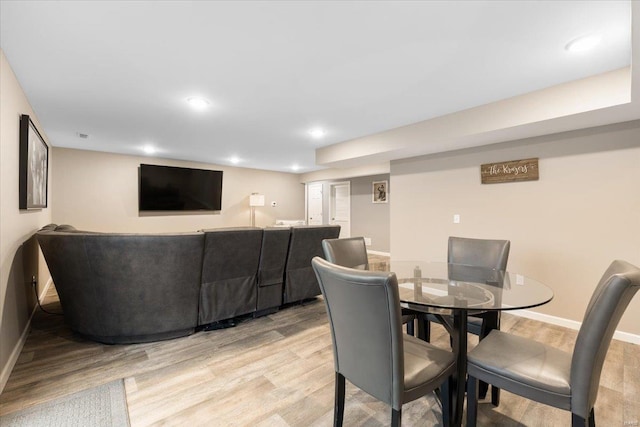 dining room featuring recessed lighting, light wood-type flooring, and baseboards