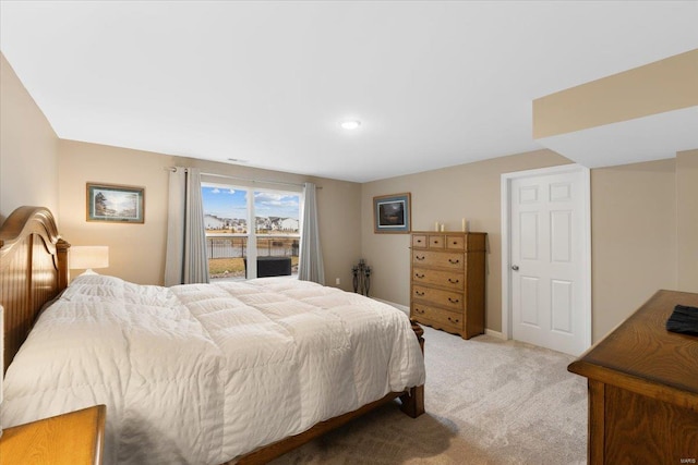 bedroom featuring light carpet