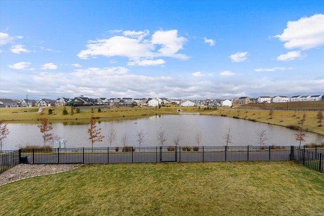 property view of water with a residential view and fence