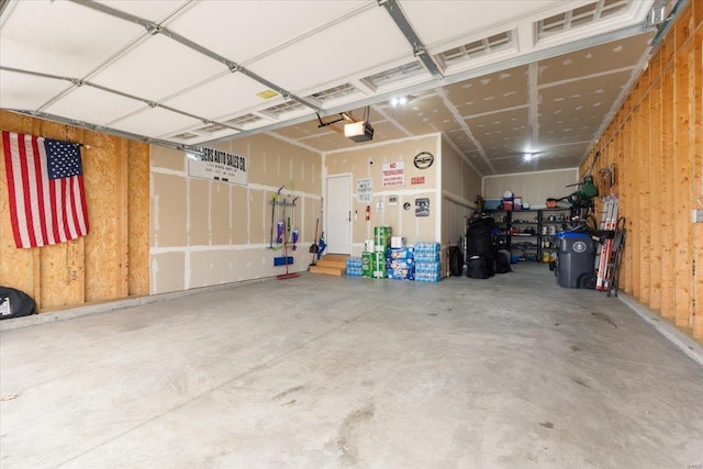 garage featuring a garage door opener