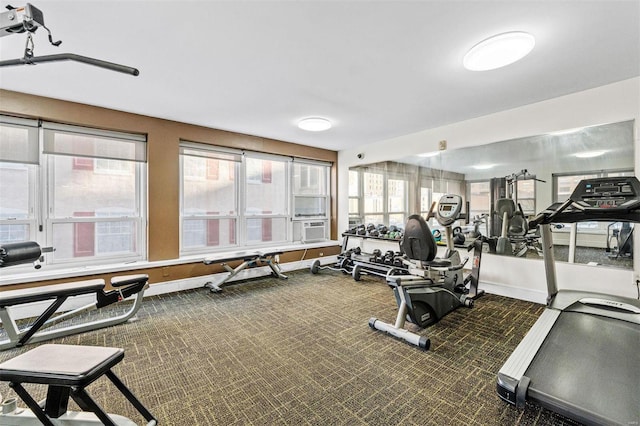 exercise room featuring cooling unit and dark carpet