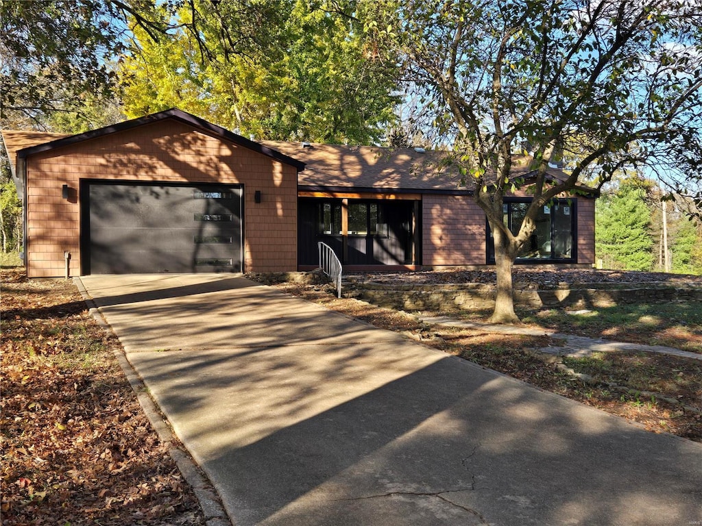 ranch-style home featuring a garage