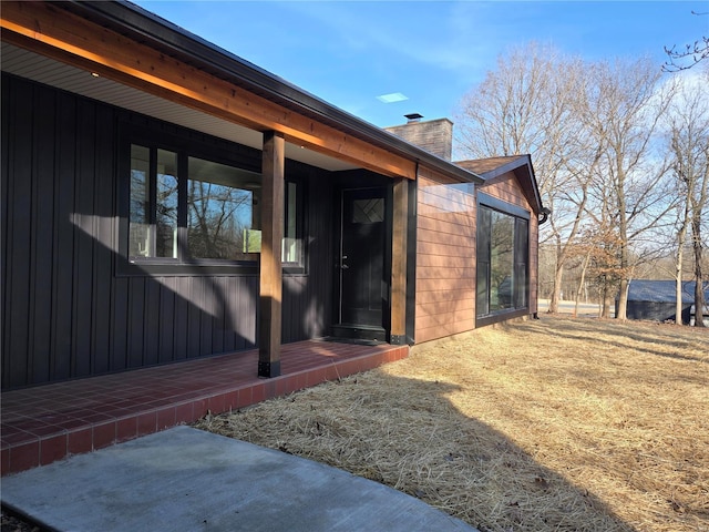 view of home's exterior featuring a chimney