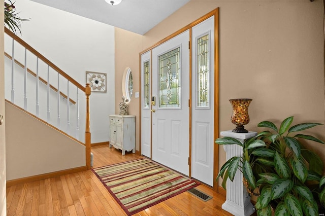 entryway with light hardwood / wood-style flooring