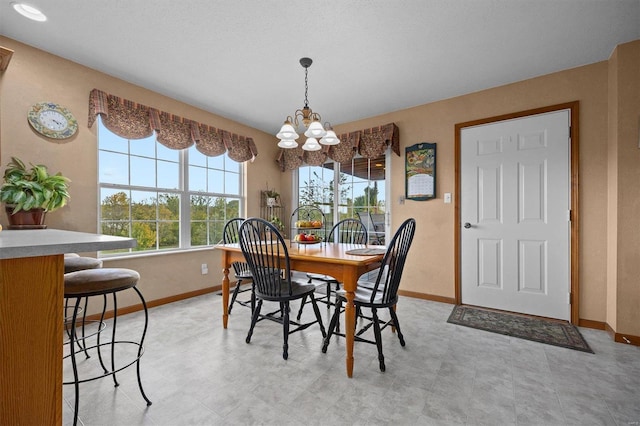 dining space featuring an inviting chandelier