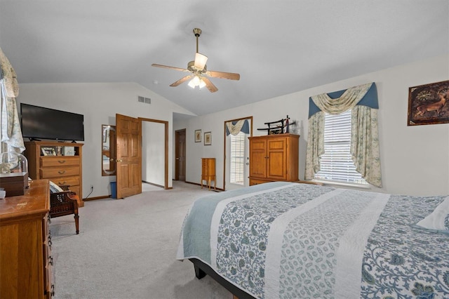 carpeted bedroom with ceiling fan and lofted ceiling