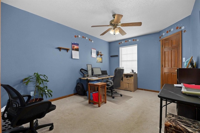 office area featuring ceiling fan, light colored carpet, and a textured ceiling