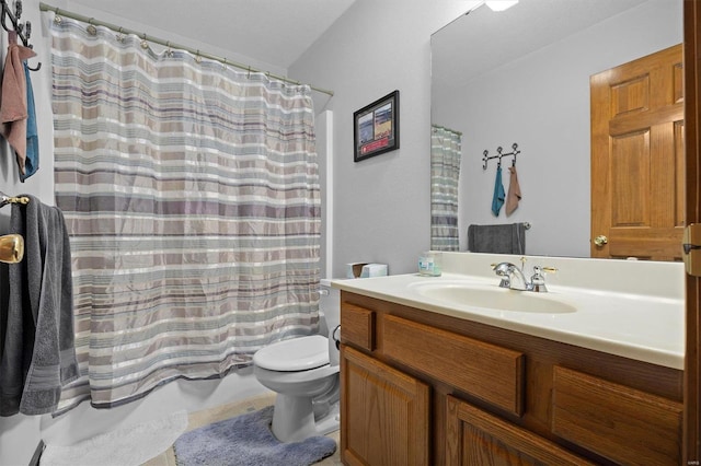 bathroom featuring vanity, a shower with shower curtain, and toilet