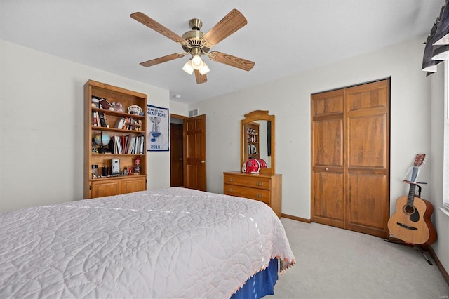 carpeted bedroom with ceiling fan