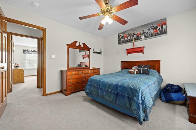 carpeted bedroom with ceiling fan