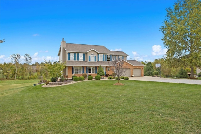 colonial inspired home featuring a garage and a front lawn