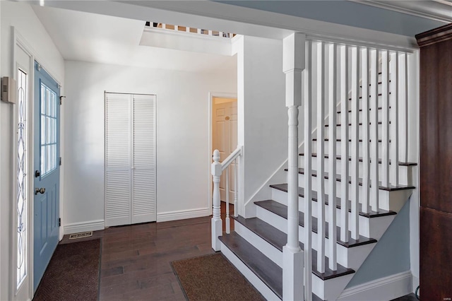 entrance foyer featuring dark hardwood / wood-style floors