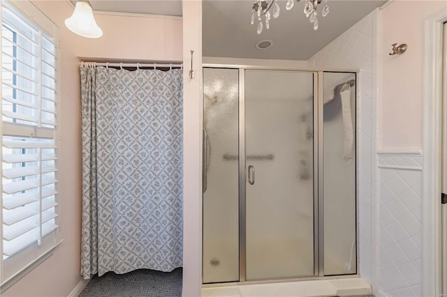 bathroom with a shower and tile patterned flooring