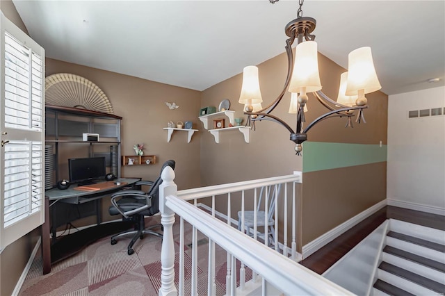 office area with a notable chandelier