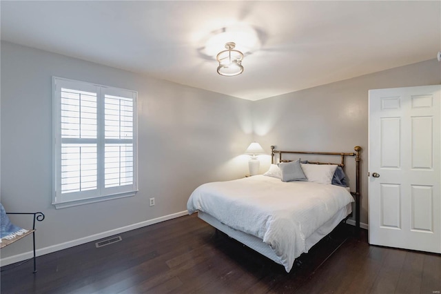 bedroom featuring dark hardwood / wood-style flooring