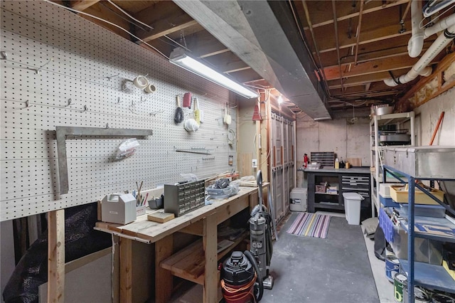 basement with a workshop area