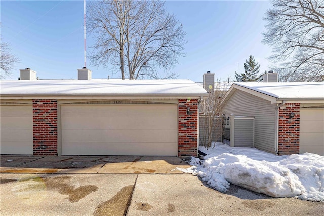 view of snow covered garage