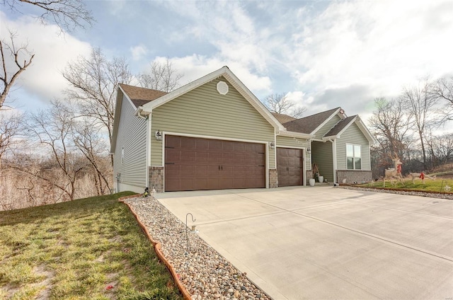 ranch-style home featuring a front yard and a garage