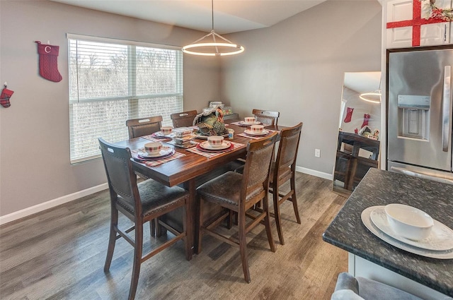 dining area featuring dark hardwood / wood-style flooring