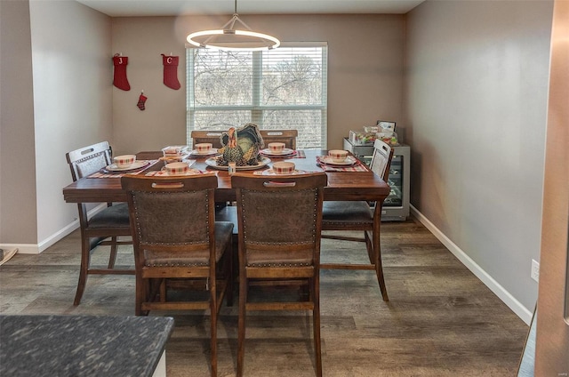 dining space with beverage cooler and dark hardwood / wood-style floors