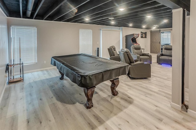 playroom featuring light hardwood / wood-style floors, a barn door, and billiards